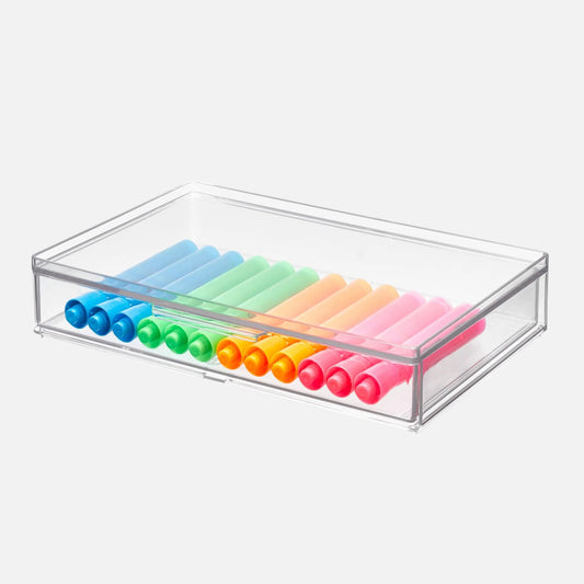 Set of colorful markers in a clear storage box on a white background