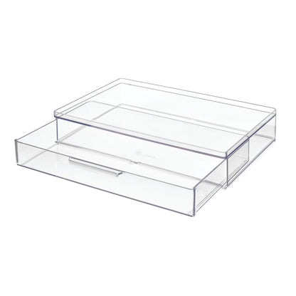 Clear plastic drawer organizer on a white background