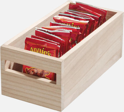 Wooden box with Annie's brand snack packs on a white background