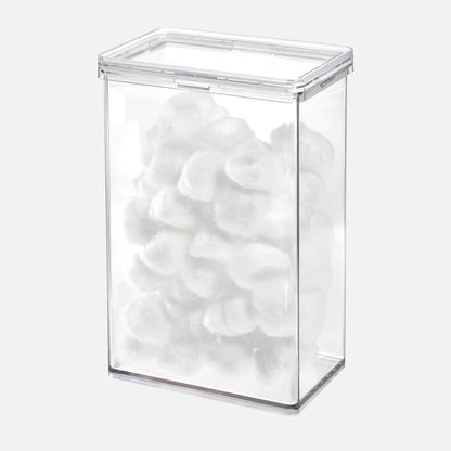 Clear rectangular container filled with white cotton balls on a white background