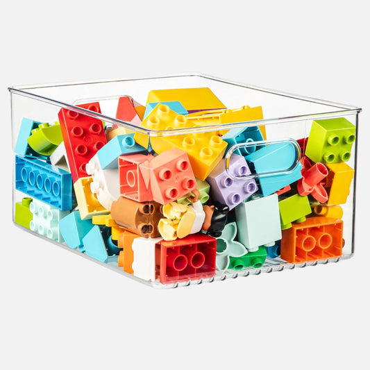 Colorful building blocks in a clear container on a white background