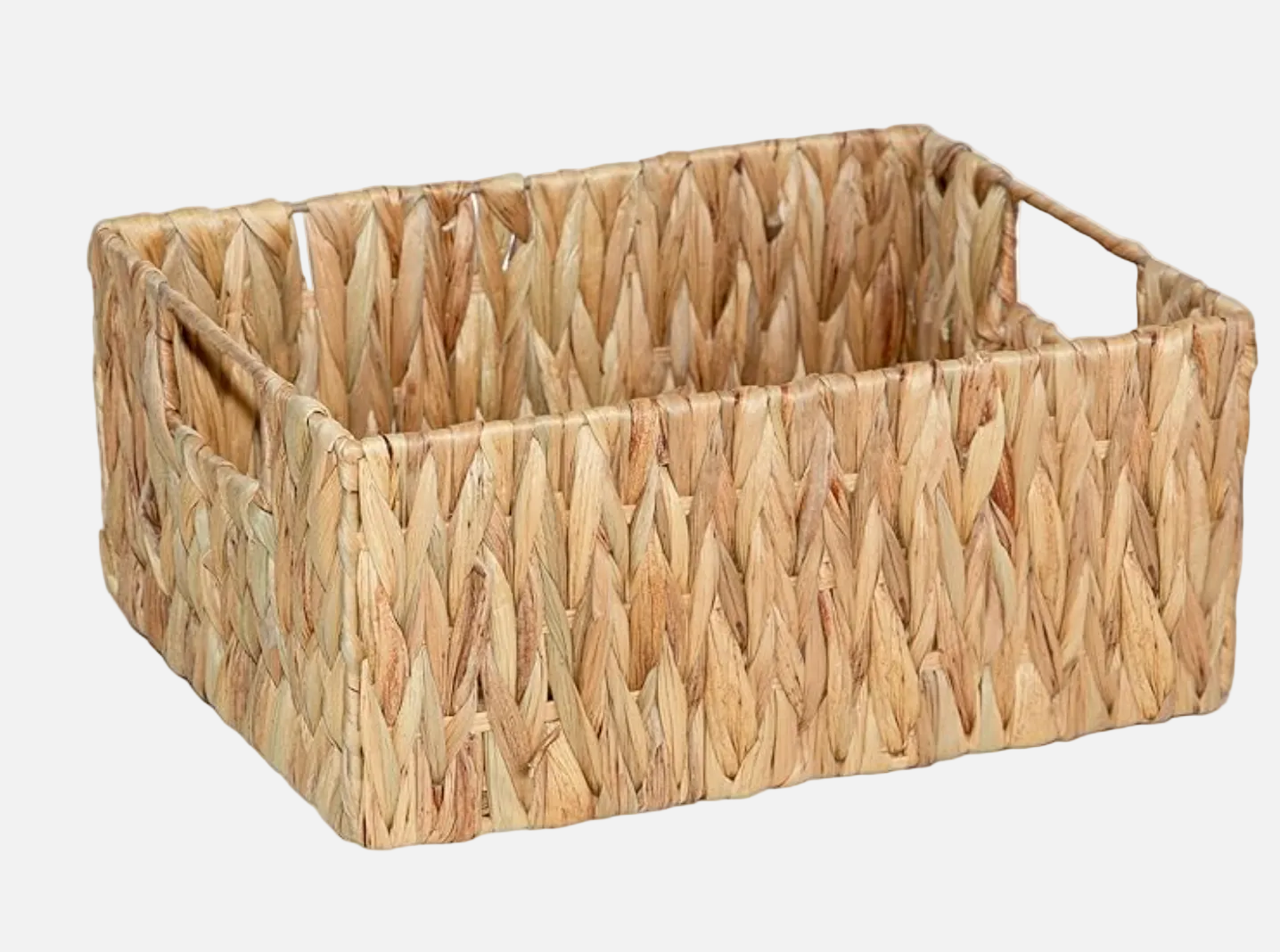 Woven rectangular basket made of natural materials on a white background
